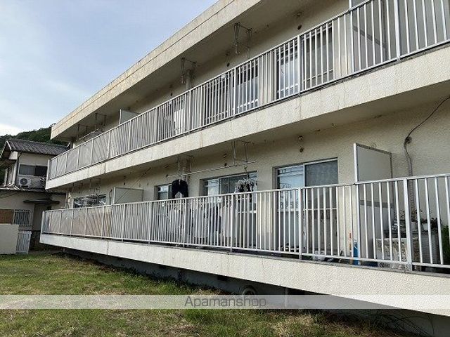 西新在家マンションの外観写真
