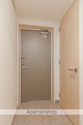 ユニゾンタワー[1LDK/52.75m2]の玄関