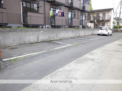 ドミールＴＯＭＯ[1K/23.18m2]の駐車場2