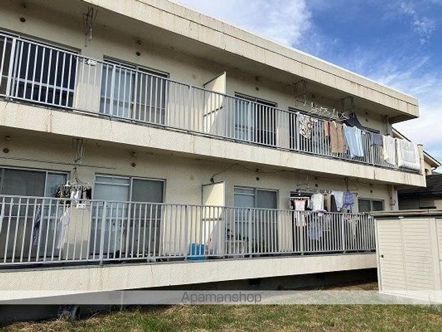 西新在家マンションの外観写真