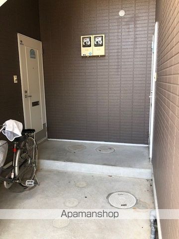 ネオクレストミツコシの玄関写真
